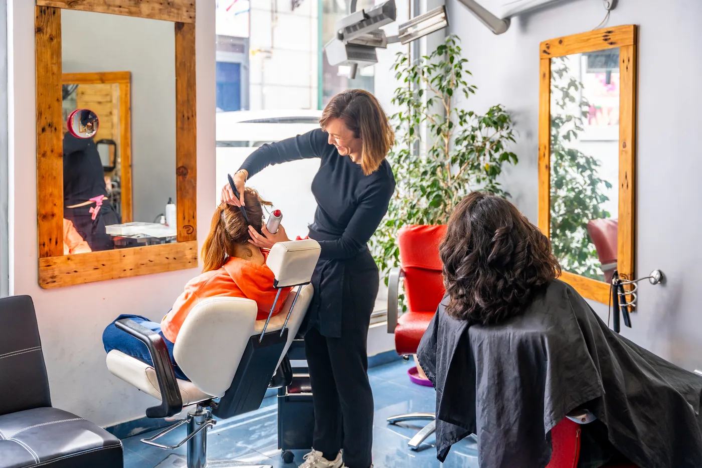 A stylist with her client